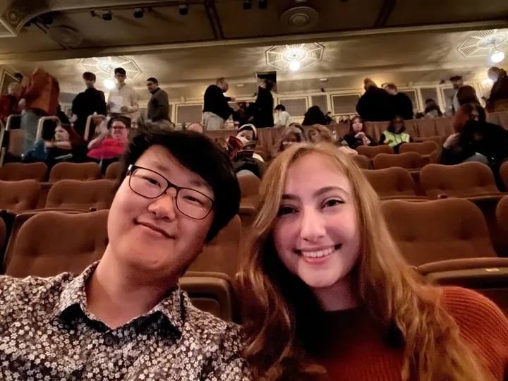 The two of us in our seats before the curtain goes up