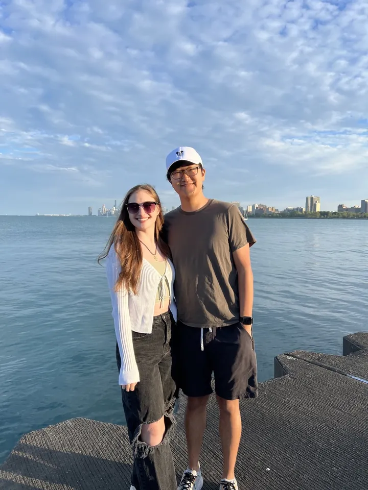 Hannah and Daniel on the lakefront, the Chicago skyline behind them
